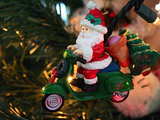 Father Christmas is coming to town riding a motor roller. It is not Santa Claus...
