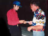 Michael Jackson signing an autograph...
