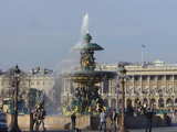A fountain on the Place de la Concorde. Behind: the Hôtel de Crillon...
